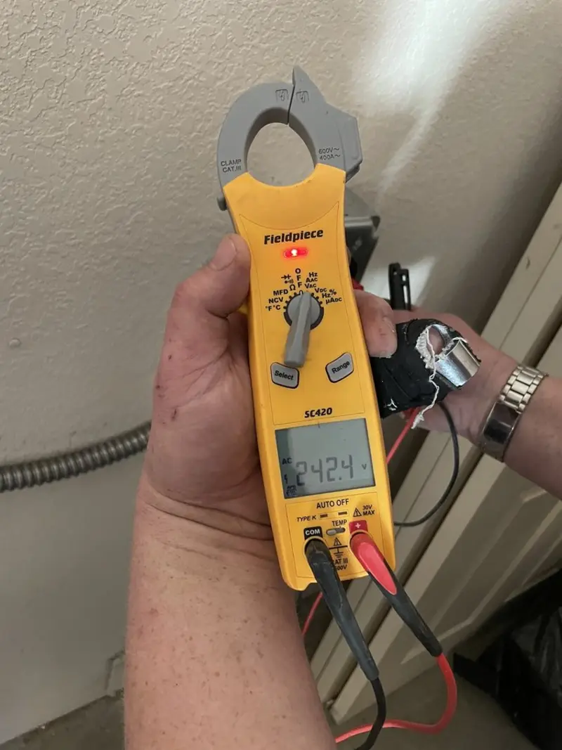 Voltage testing with clamp meter during Circuit Breaker Repair in Williamston